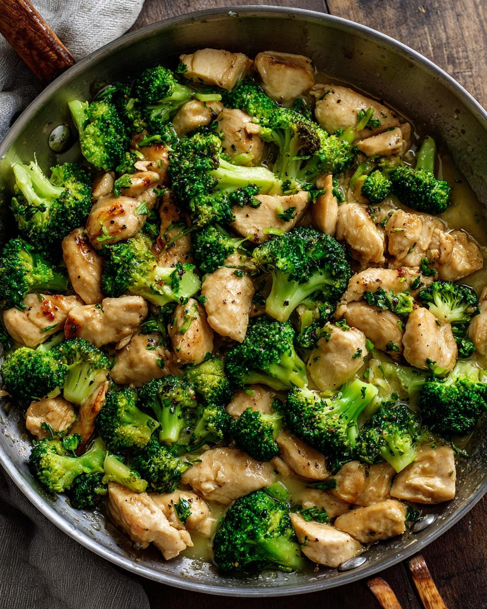Overhead view of a Chicken Broccoli Skillet, featuring tender chicken and bright green broccoli florets.