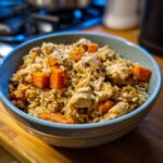 A bowl of delicious Chicken & Sweet Potato Rice, featuring tender chicken and sweet potato chunks.