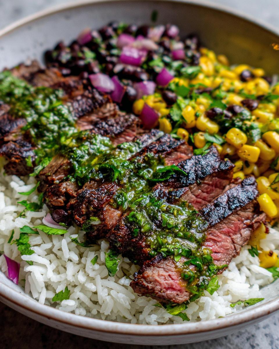 A delicious CILANTRO LIME STEAK BOWLS with rice, grilled steak, corn, and black bean salsa.