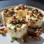 Four Crab Crescent Bites Delight topped with walnuts and parsley on a plate, ready to be served.