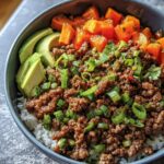 A vibrant Ground Beef Protein Bowl with rice, seasoned ground beef, avocado, and sweet potato.