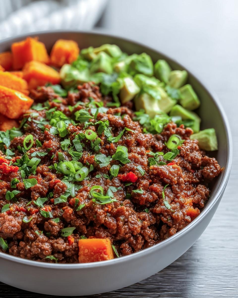 A vibrant Ground Beef Protein Bowl with ground beef, avocado, and sweet potato.