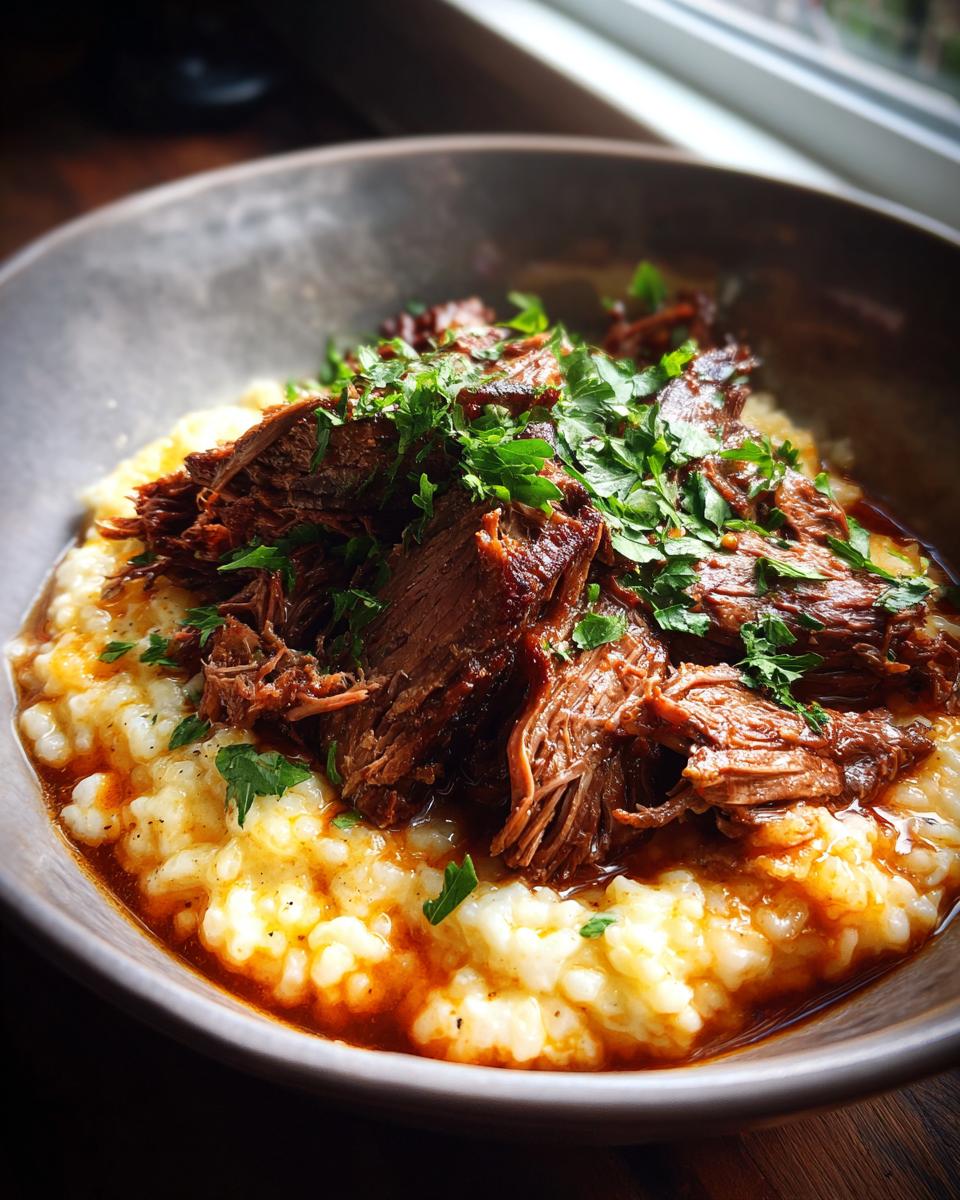 A bowl of Italian Pot Roast & Parmesan Risotto, garnished with fresh parsley.