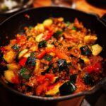 A close-up of a 5-Ingredient Dinner Recipe with zucchini, peppers, and other ingredients in a skillet.