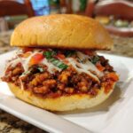 Close-up of a cheesy sloppy joe sandwich, part of our ultimate dinner recipes guide.