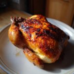 Whole roast chicken with crispy skin, showcasing one of the Best Easy Dinner Recipes 2025.