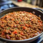 Pan of chili with ground beef, beans, and tomatoes, a quick and easy ground beef recipe.
