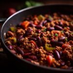Close-up of Ground Turkey Chili in a pan, featuring ground turkey, kidney beans, and vegetables.