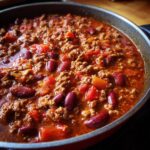 Close-up of a pan of chili with ground meat, kidney beans, and tomatoes, showcasing What Makes Perfect Dinner Ideas? Try This.