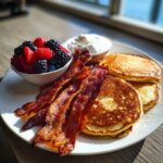 Pancakes, crispy bacon, fresh berries, and cream, a delicious Breakfast Ideas Recipe Everyone Asks For.