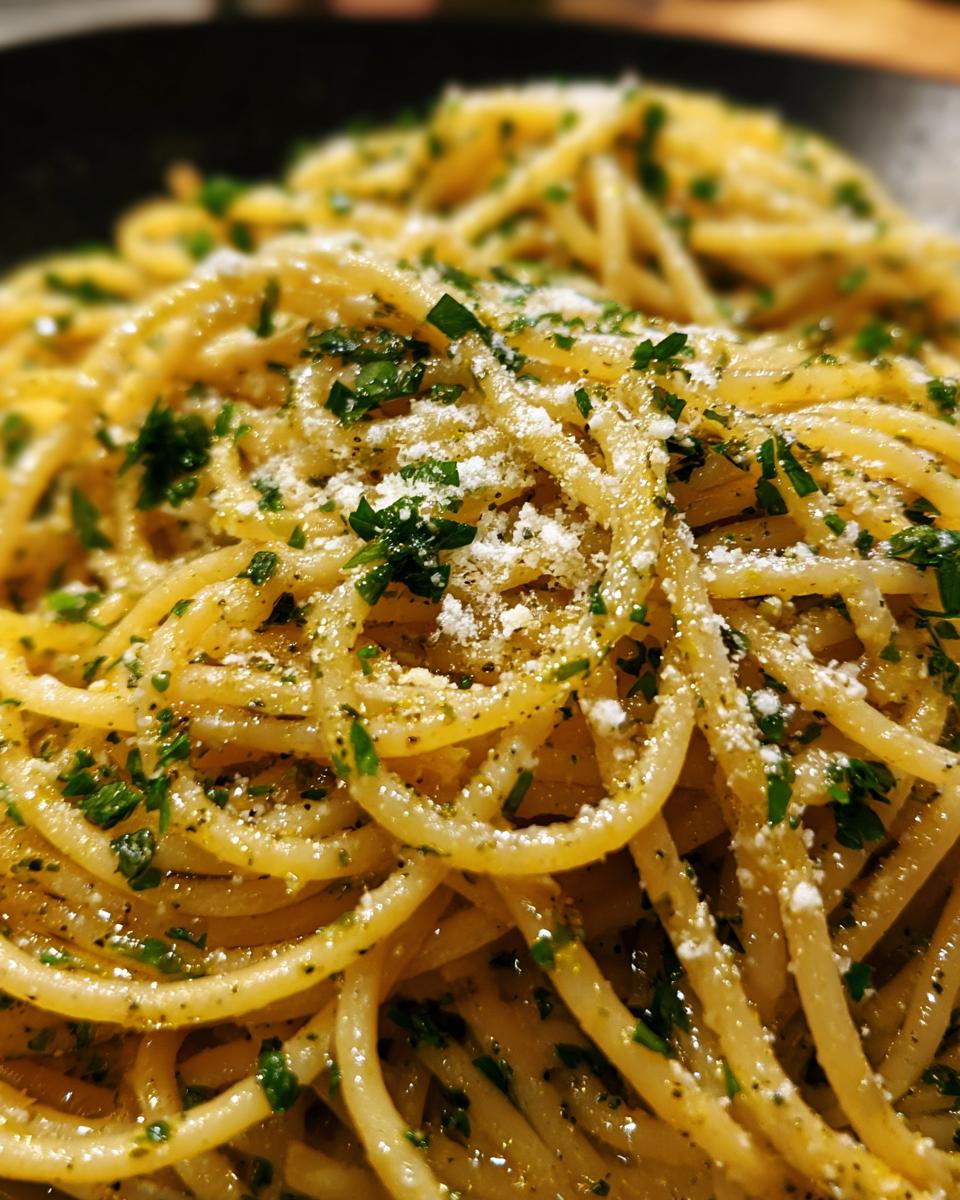 Close-up of spaghetti with parsley and cheese, illustrating What Makes Perfect Pasta Recipes? Try This.