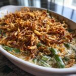 Close-up of Restaurant-Style Thanksgiving Green Beans with creamy sauce and crispy fried onion topping.