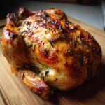 Golden brown roasted chicken with herbs, perfect for the Ultimate Chicken Guide.