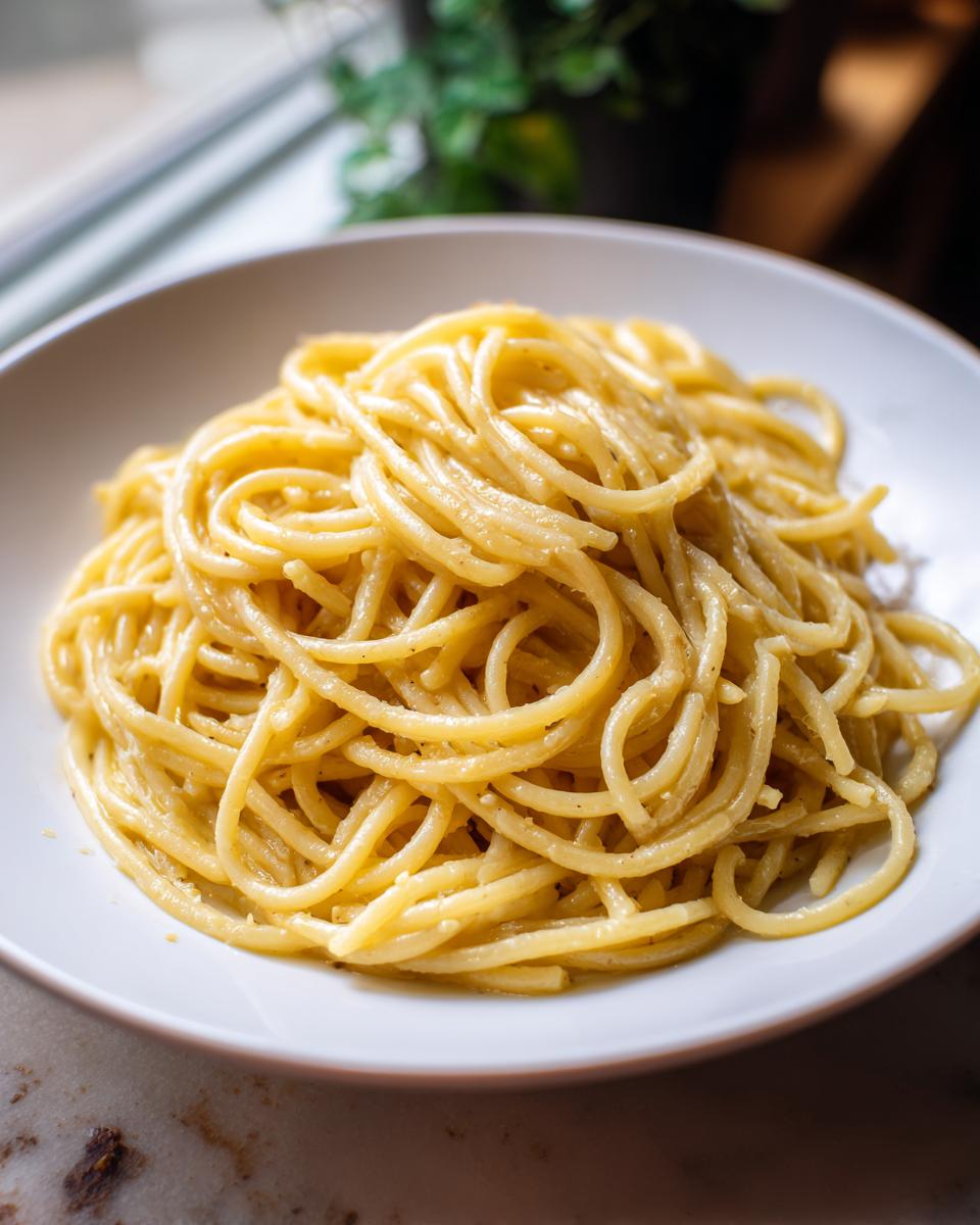 A plate of spaghetti, showcasing a simple pasta recipe. Perfect for learning how to make pasta recipes.