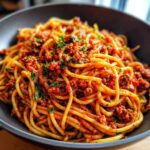 Bowl of spaghetti with Bolognese sauce, a delicious and easy pasta recipe for busy weeknights.