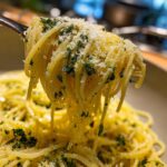 Close-up of spaghetti with herbs and cheese, illustrating What Makes Perfect Pasta Recipes? Try This.