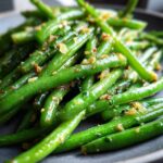 Close-up of Thanksgiving Green Beans, sautéed with garlic and herbs, ready to serve.