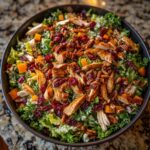 Overhead view of a colorful 5-Ingredient Thanksgiving Salad Recipe with chicken, cranberries, pecans, and butternut squash.